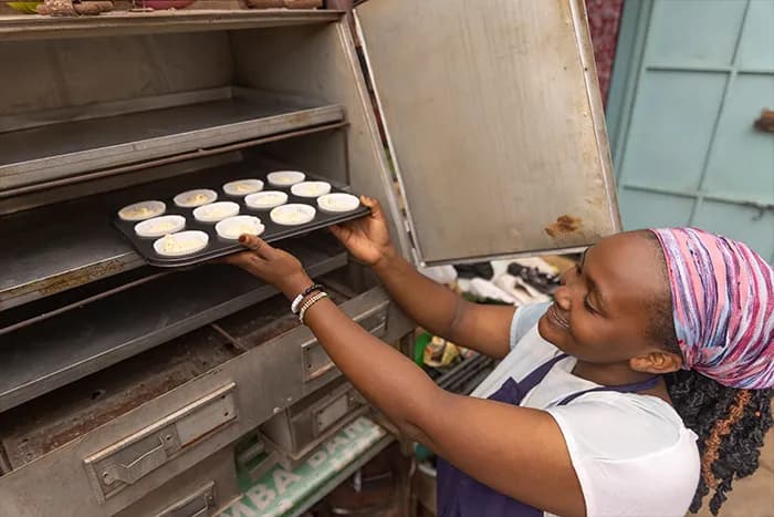 Peninah with baked goods from the catering business built on her baking skills.